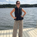 Entro Sleeveless 1/2 Zip Ruffle Waist Top.