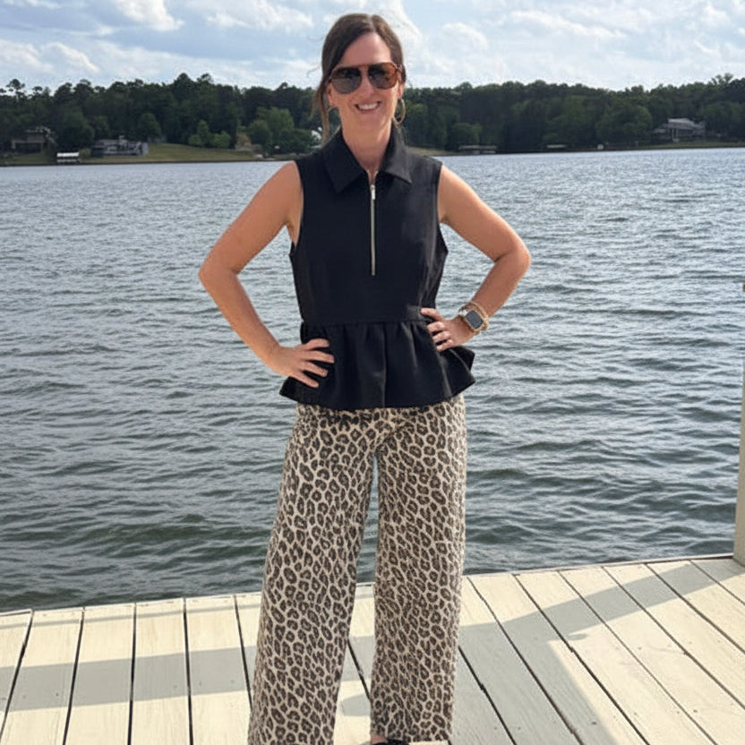 Entro Sleeveless 1/2 Zip Ruffle Waist Top.